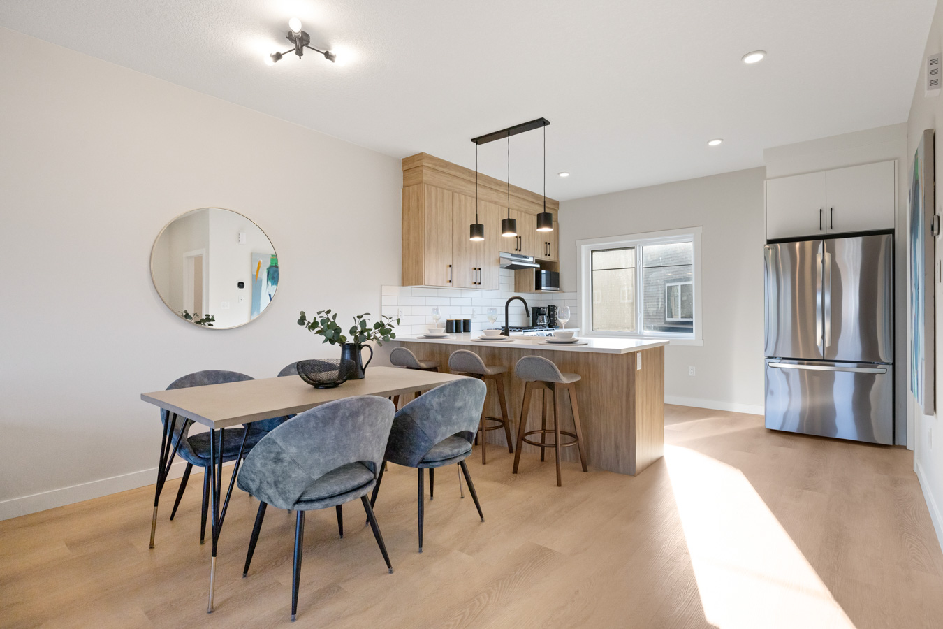 Modern kitchen and dining area in a Cherry Hills townhome
