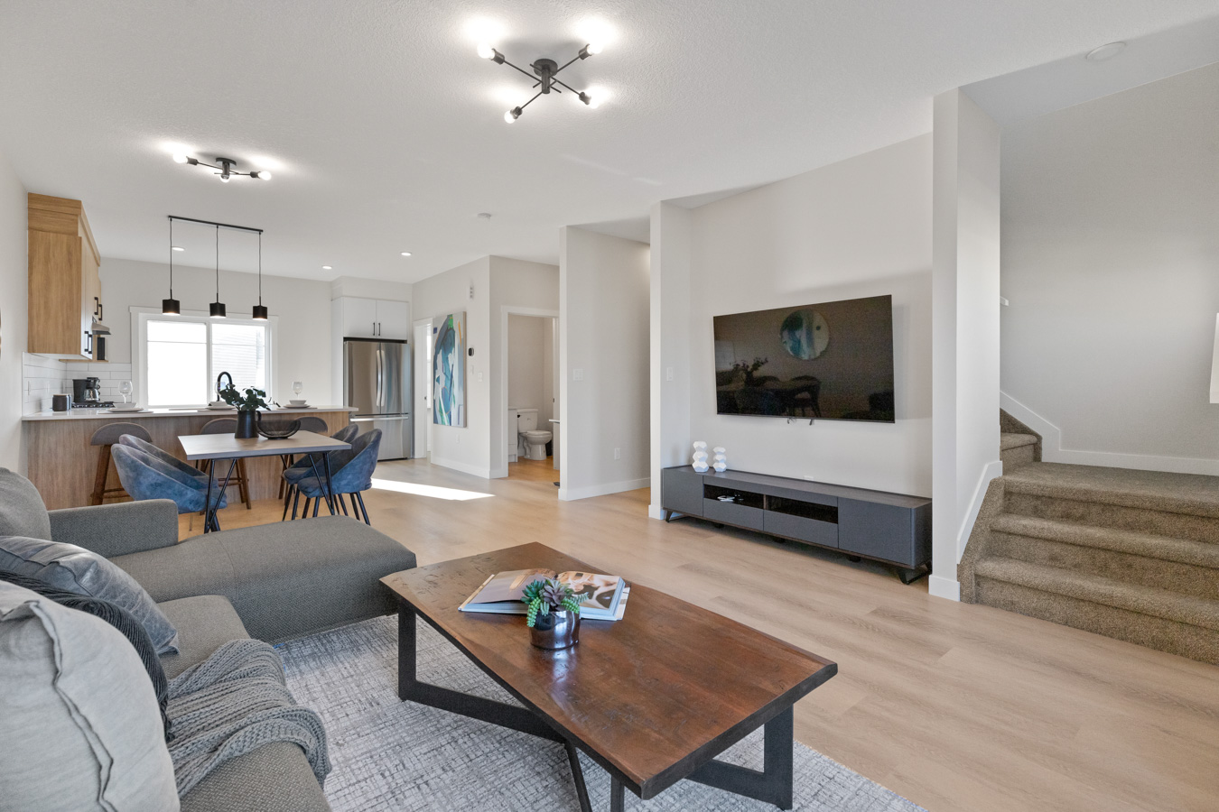 Open-concept main floor with living, dining, and kitchen areas