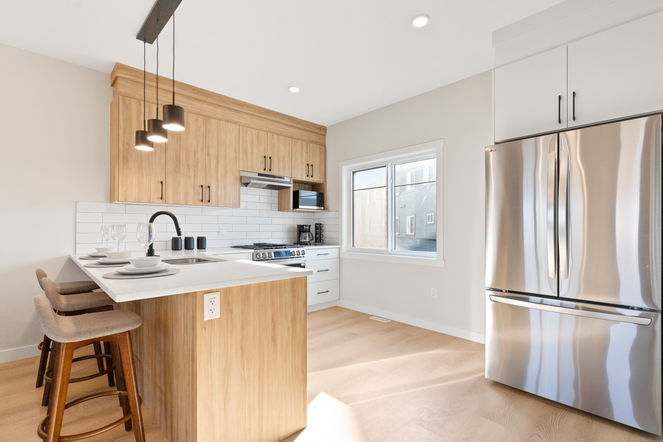 Modern two-tone kitchen with stainless steel appliances
