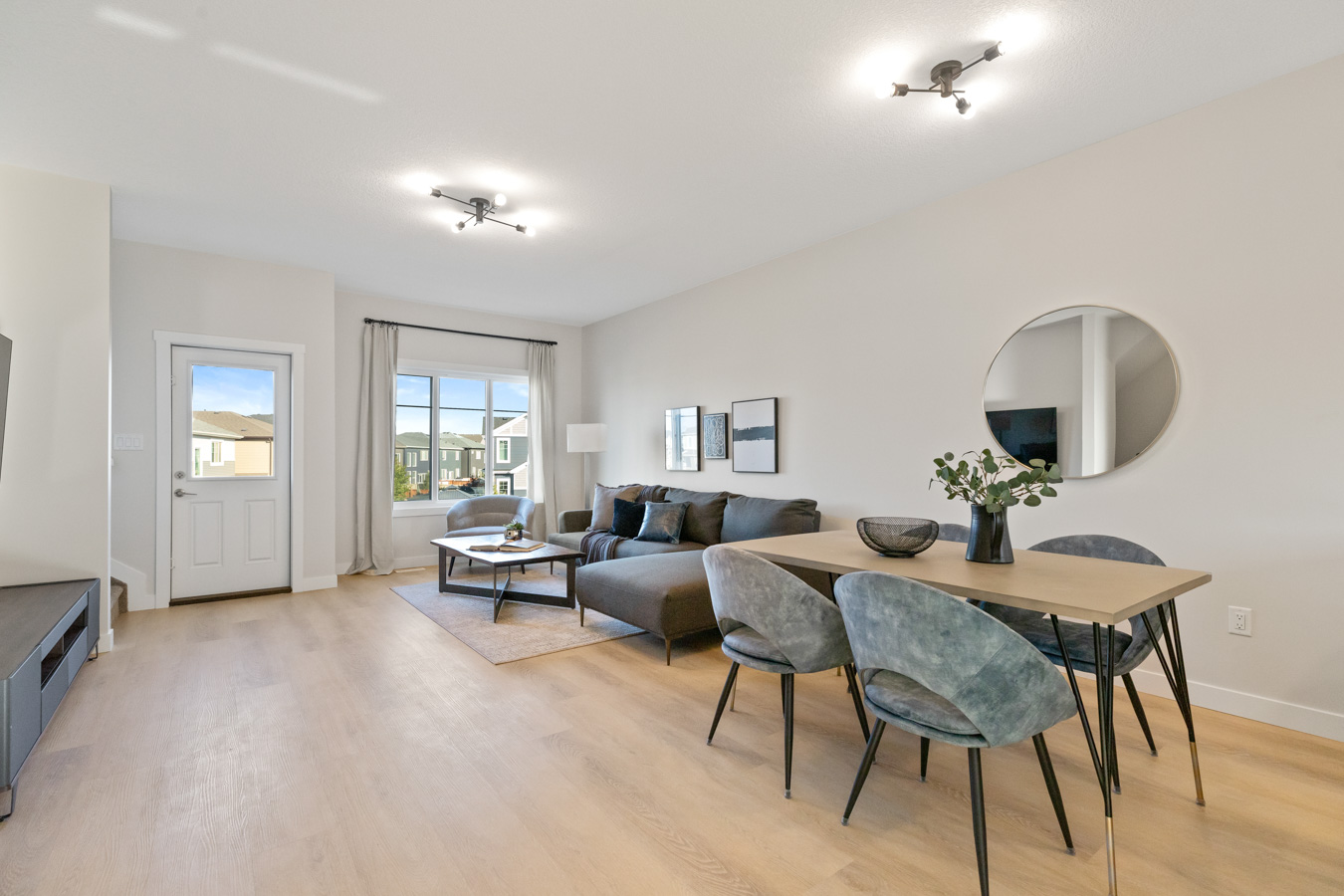 Open-concept living and dining room in a Cherry Hills townhome