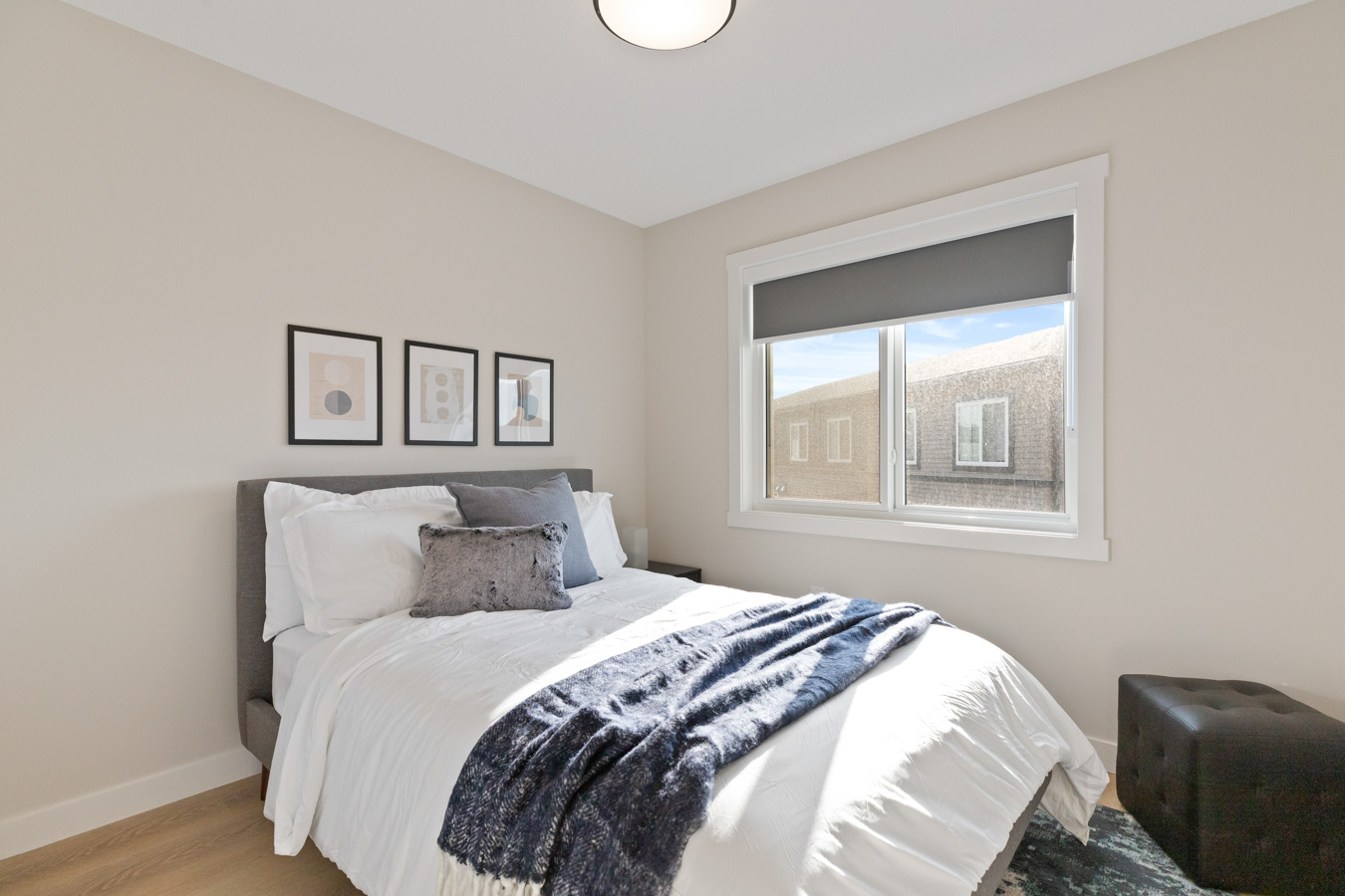Secondary bedroom with a large window